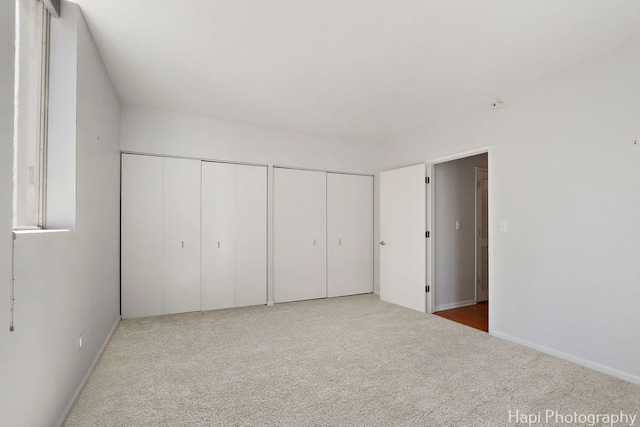 21 W Chestnut St Unit 1509, Chicago, IL 60610 - unfurnished bedroom featuring two closets and carpet