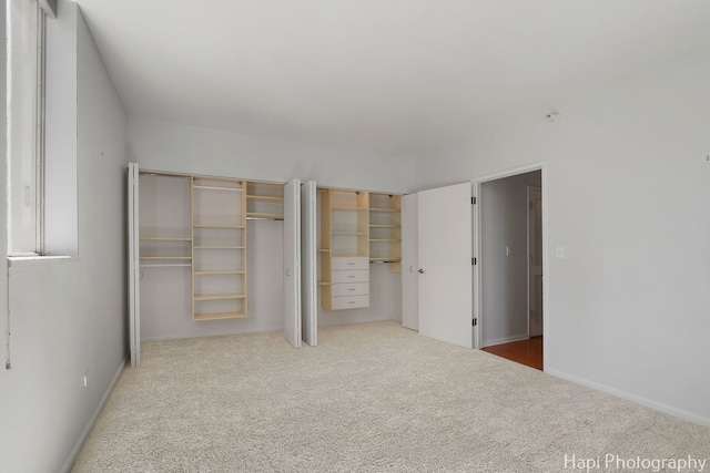 21 W Chestnut St Unit 1509, Chicago, IL 60610 - unfurnished bedroom with two closets and carpet floors