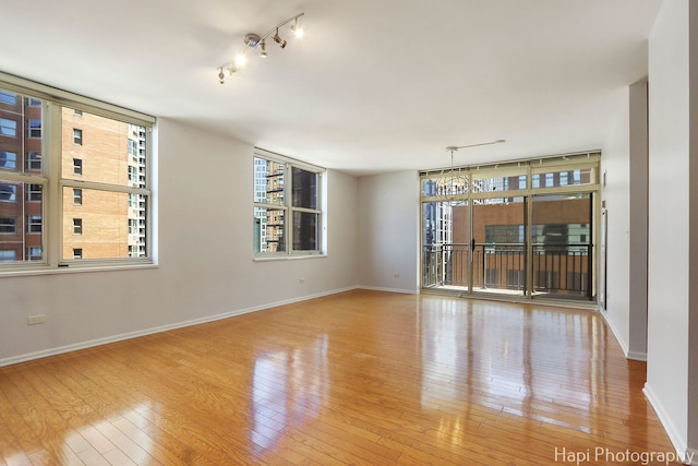 21 W Chestnut St Unit 1509, Chicago, IL 60610 - spare room featuring hardwood / wood-style flooring and track lighting