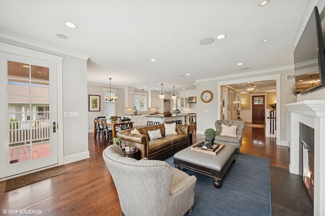 1605 N Chicago Ave, Arlington Heights, IL 60004 - living room with a chandelier, ornamental molding, a glass covered fireplace, recessed lighting, and dark wood finished floors