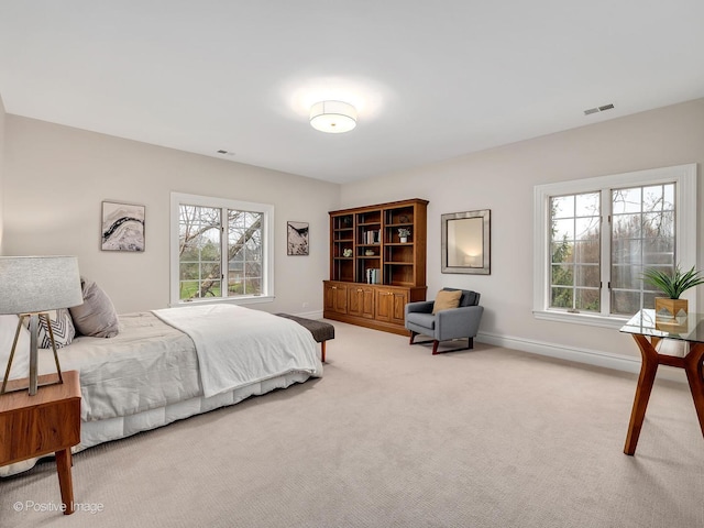 8 Longwood Dr, Burr Ridge, IL 60527 - bedroom with multiple windows, visible vents, light colored carpet, and baseboards