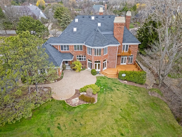 8 Longwood Dr, Burr Ridge, IL 60527 - rear view of house with a chimney, a lawn, brick siding, french doors, and a balcony