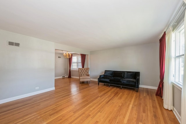 1919 Sunnyside Ave, Westchester, IL 60154 - sitting room featuring a chandelier, light wood-style floors, and baseboards