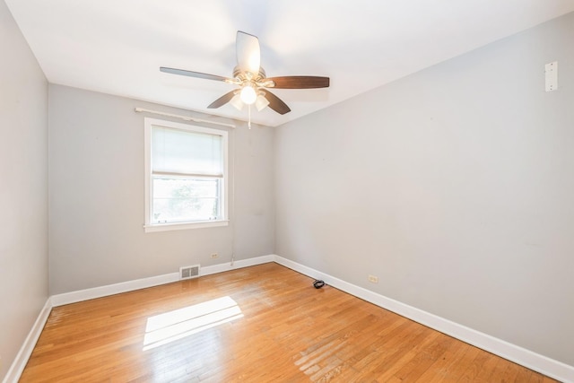 1919 Sunnyside Ave, Westchester, IL 60154 - unfurnished room with baseboards, light wood-style flooring, and a ceiling fan