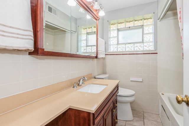 1919 Sunnyside Ave, Westchester, IL 60154 - full bathroom featuring tile walls, vanity, tile patterned flooring, and toilet