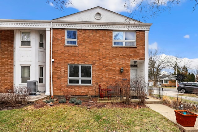 5770 N Forest Glen Ave, Chicago, IL 60646 - view of front of home with brick siding, central AC, and fence