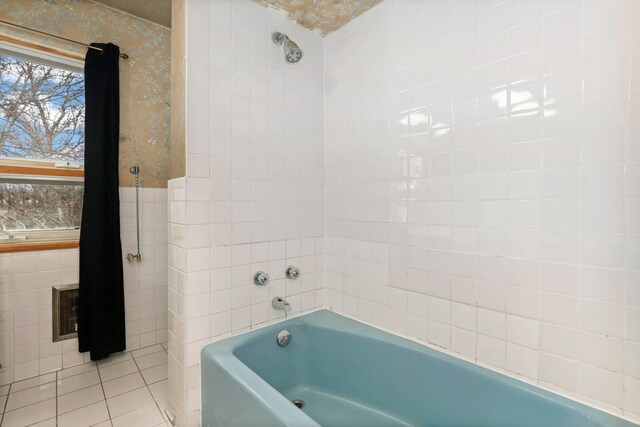 5770 N Forest Glen Ave, Chicago, IL 60646 - bathroom featuring wallpapered walls, tile patterned flooring, a washtub, and tile walls