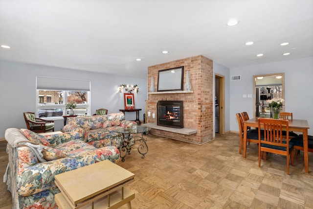 5770 N Forest Glen Ave, Chicago, IL 60646 - living area featuring a brick fireplace, visible vents, and recessed lighting