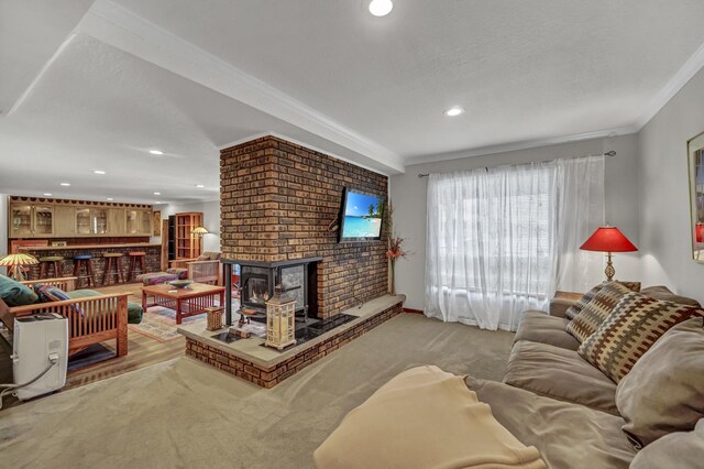 245 Banbury Rd, Mundelein, IL 60060 - carpeted living area featuring ornamental molding, recessed lighting, and a wood stove