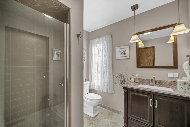 245 Banbury Rd, Mundelein, IL 60060 - full bath featuring toilet, vanity, a shower stall, and baseboards