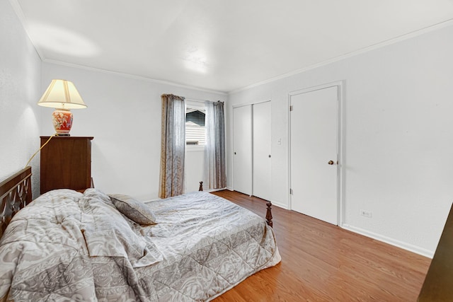 bedroom featuring wood finished floors and ornamental molding