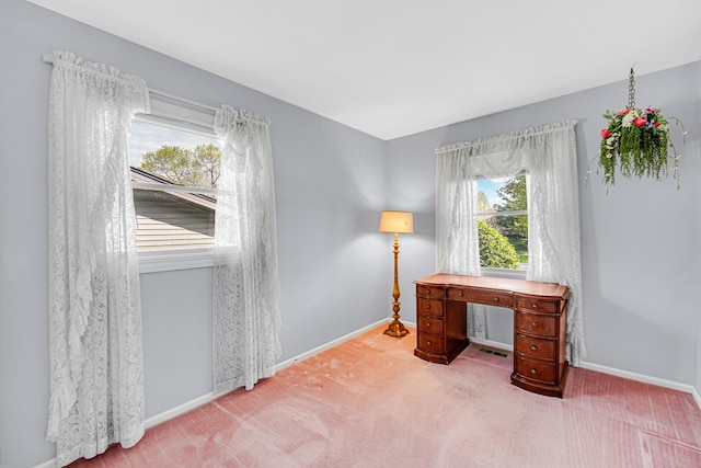 carpeted office space with baseboards