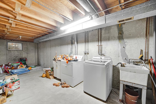 unfinished below grade area featuring washer and dryer