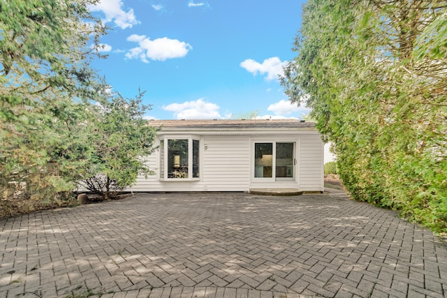 rear view of property with a patio area