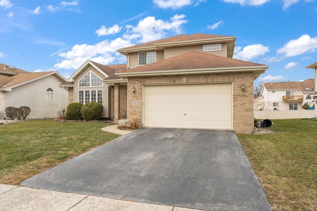 18020 Charlotte Dr, Lansing, IL 60438 - traditional-style house with a front lawn, aphalt driveway, brick siding, a garage, and a shingled roof