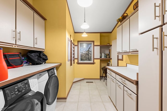 8712 W 121st St, Palos Park, IL 60464 - clothes washing area featuring washing machine and dryer, cabinet space, baseboards, light tile patterned floors, and crown molding