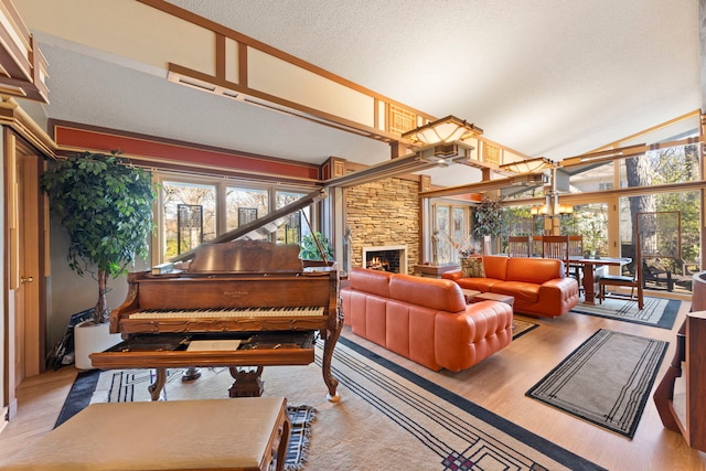 8712 W 121st St, Palos Park, IL 60464 - living room featuring high vaulted ceiling, plenty of natural light, wood finished floors, a fireplace, and a textured ceiling
