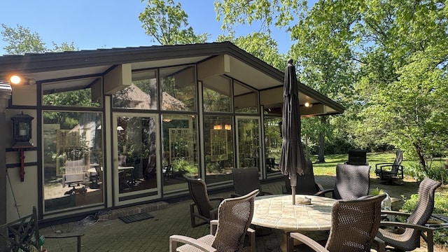 8712 W 121st St, Palos Park, IL 60464 - view of patio / terrace with outdoor dining space and a sunroom
