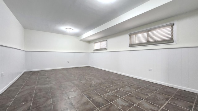 below grade area featuring baseboards