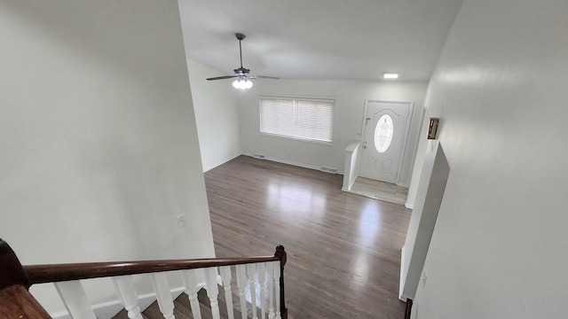 foyer featuring baseboards, wood finished floors, and ceiling fan