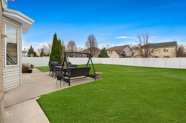 view of yard featuring a patio and a fenced backyard