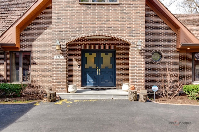 property entrance with brick siding