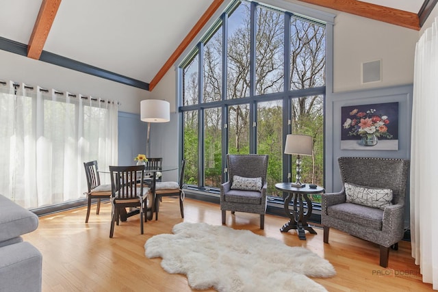 sunroom with healthy amount of natural light and baseboard heating