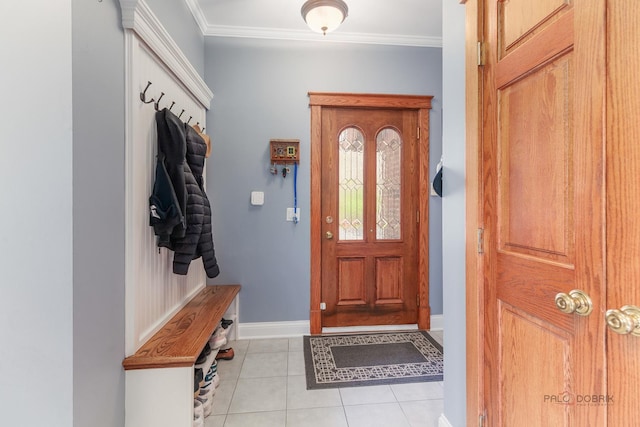 mudroom featuring ornamental molding, light tile patterned floors, and baseboards