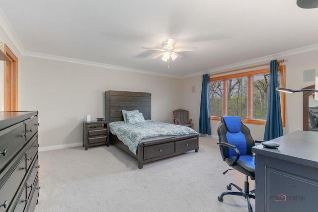 bedroom featuring crown molding, light carpet, a desk, baseboards, and ceiling fan