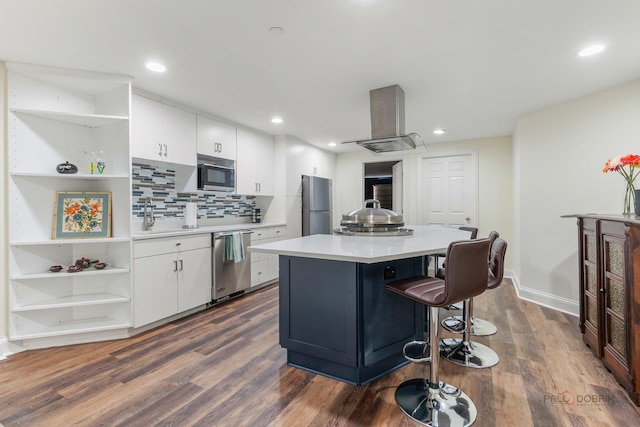 kitchen featuring open shelves, appliances with stainless steel finishes, range hood, white cabinets, and recessed lighting