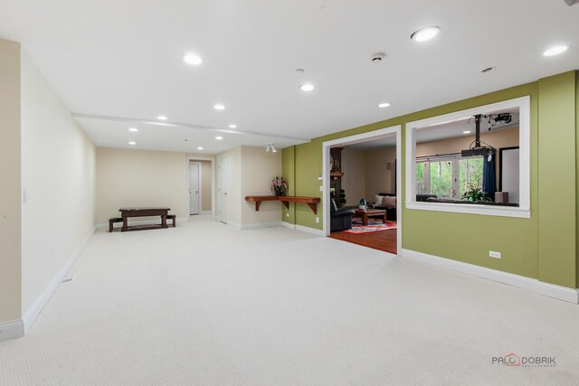 workout room featuring carpet floors, recessed lighting, and baseboards