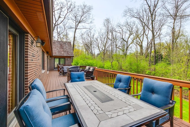 wooden terrace featuring outdoor dining space