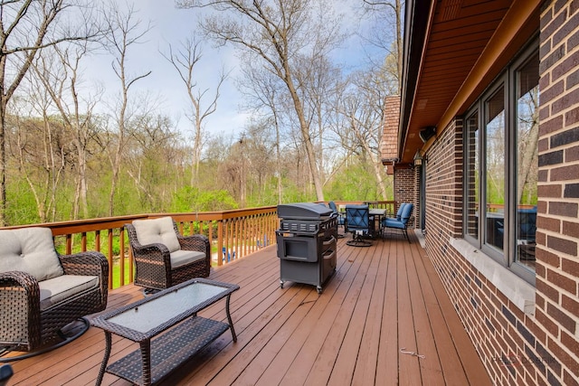 wooden deck with an outdoor living space, area for grilling, and outdoor dining area