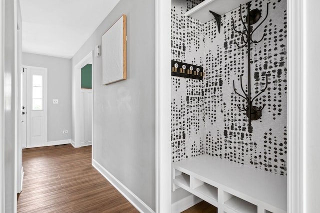 mudroom with baseboards and wood finished floors
