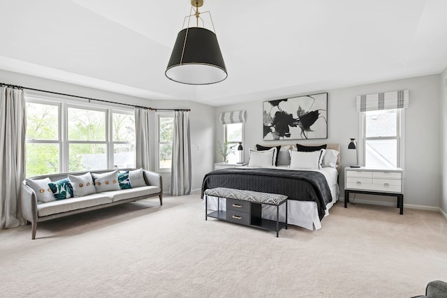bedroom with carpet floors and baseboards