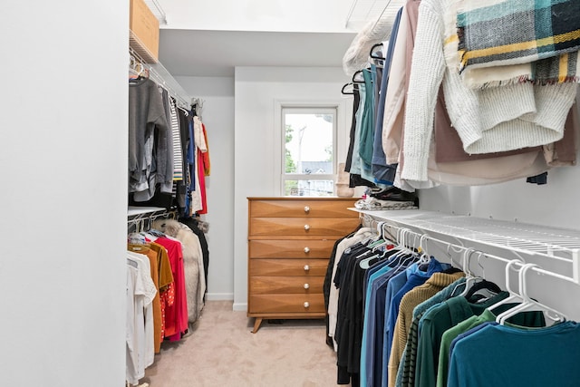 spacious closet featuring light carpet