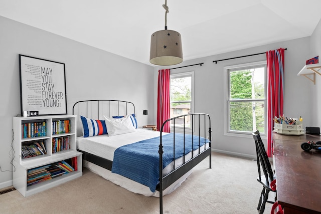 bedroom featuring baseboards and carpet