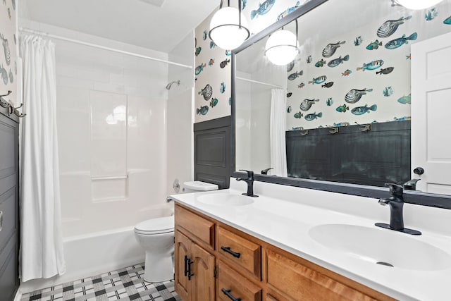 bathroom with a sink, tile patterned floors, shower / tub combo with curtain, and toilet