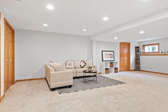living area with recessed lighting, baseboards, and light carpet