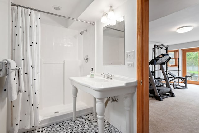 full bath featuring a sink and a stall shower
