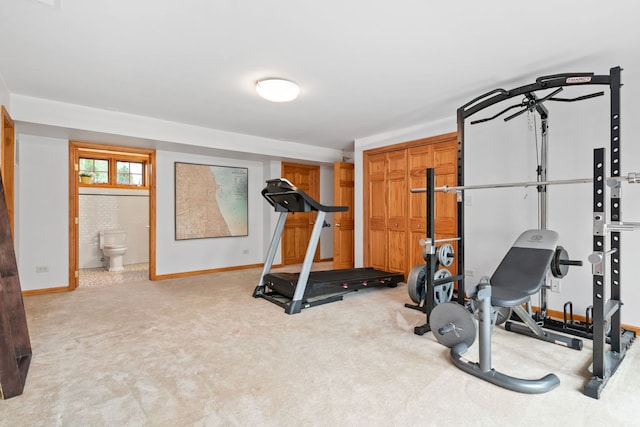 workout area with carpet floors and baseboards