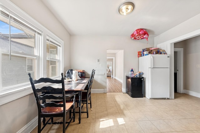 123 Philippa Ave, Waukegan, IL 60085 - dining room with a wealth of natural light, baseboards, and light tile patterned floors