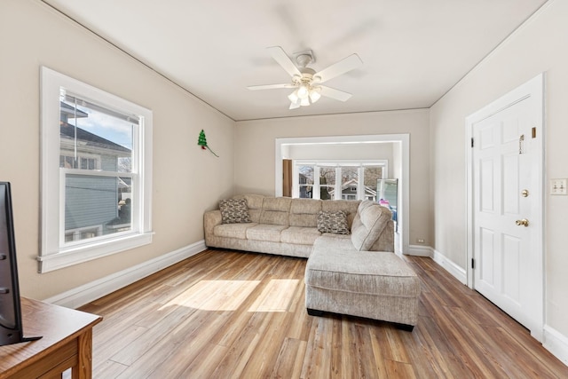 123 Philippa Ave, Waukegan, IL 60085 - living room featuring ceiling fan, baseboards, and light wood finished floors