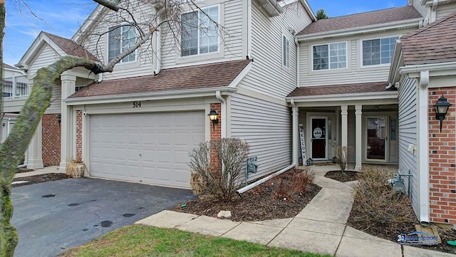514 E Thornhill Ln, Palatine, IL 60074 - view of front of home featuring a shingled roof, aphalt driveway, brick siding, and an attached garage