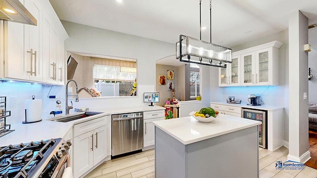514 E Thornhill Ln, Palatine, IL 60074 - kitchen with light countertops, dishwasher, beverage cooler, and a sink