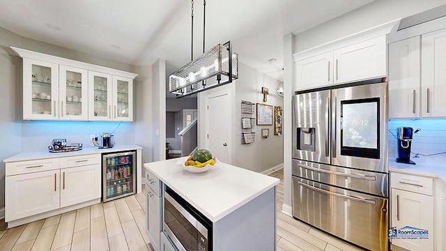 514 E Thornhill Ln, Palatine, IL 60074 - kitchen with stainless steel appliances, beverage cooler, wood tiled floor, and white cabinetry
