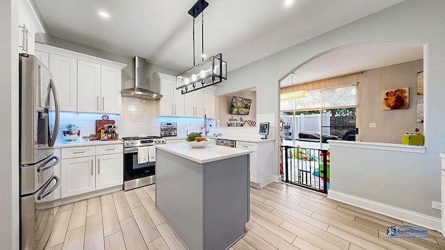 514 E Thornhill Ln, Palatine, IL 60074 - kitchen with wall chimney range hood, light countertops, wood tiled floor, and appliances with stainless steel finishes