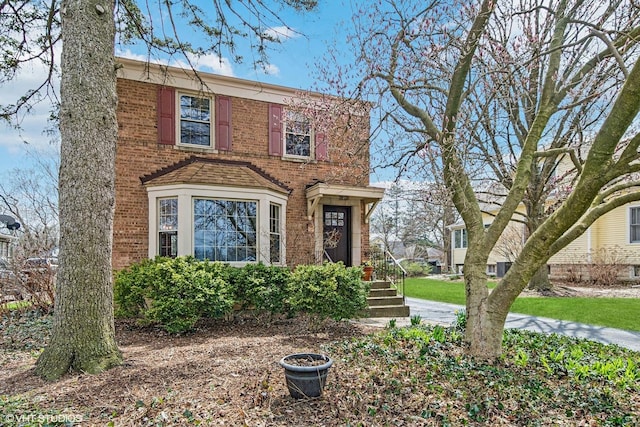 traditional home with brick siding