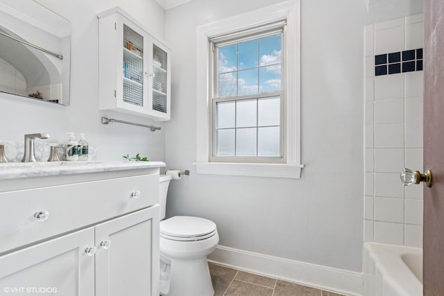 full bath featuring toilet, tile patterned floors, baseboards, and vanity