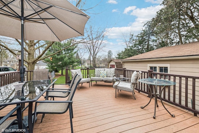 wooden terrace featuring outdoor dining area